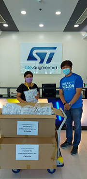 Two people bringing a trolley with masks